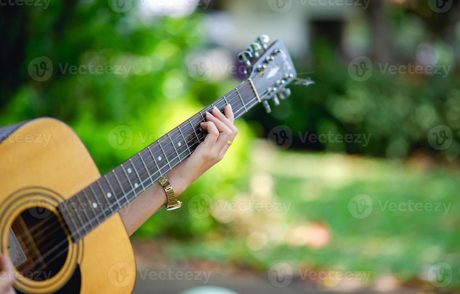 Musician hands and acoustic guitars, musical instruments with very good sound Musical instrument concept photo