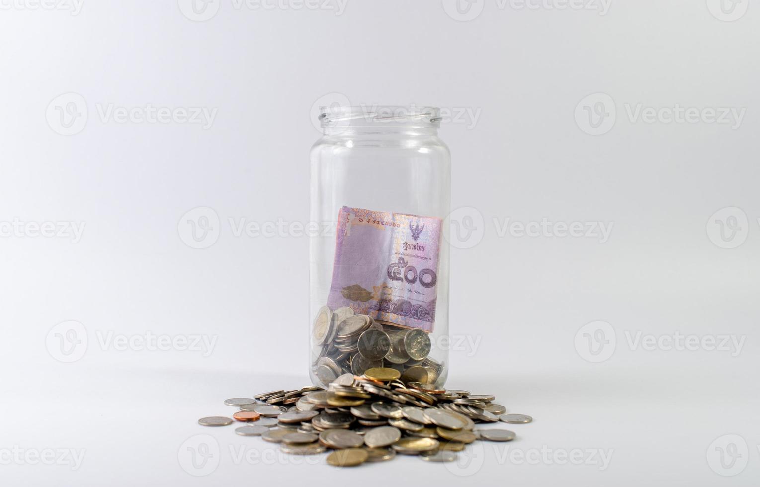 Saving money, saving money for the future ahead of life. And silver on a white background photo