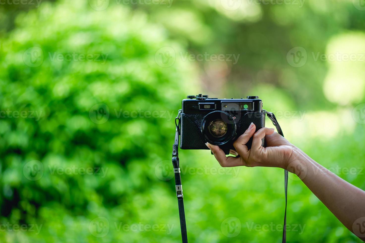 Hand and camera Of professional photographers Concept photographer photo