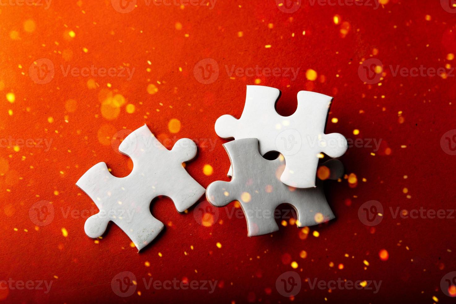 White puzzles placed on an orange background Represent the unity and power of successful people photo