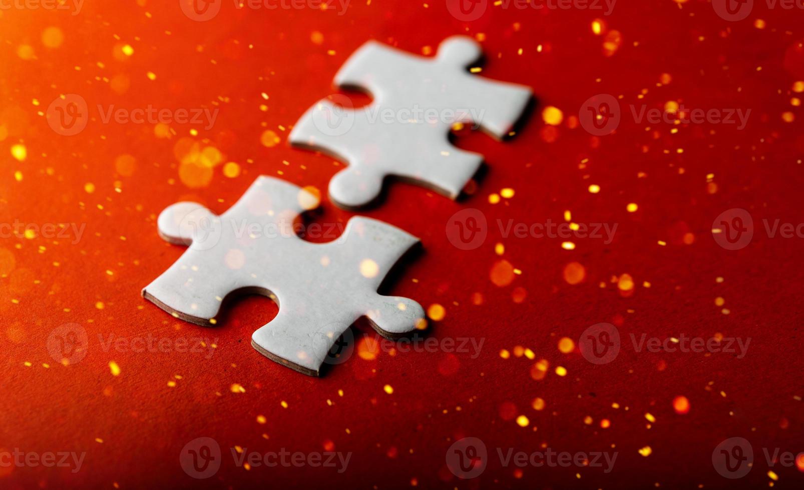 White puzzles placed on an orange background Represent the unity and power of successful people photo