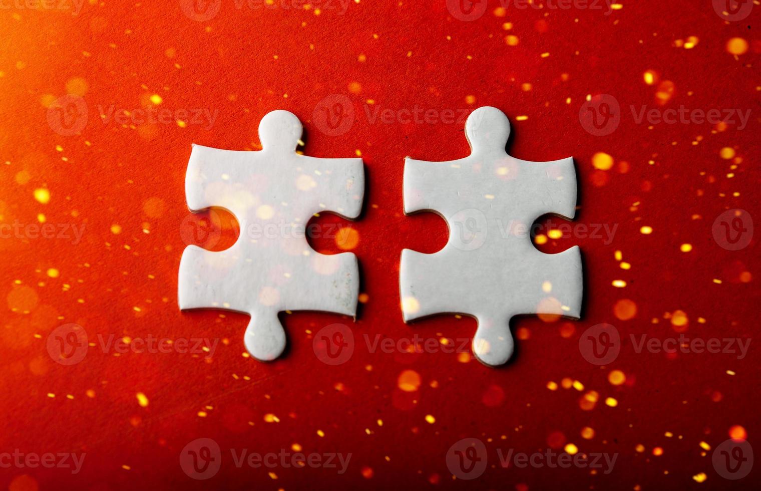 White puzzles placed on an orange background Represent the unity and power of successful people photo