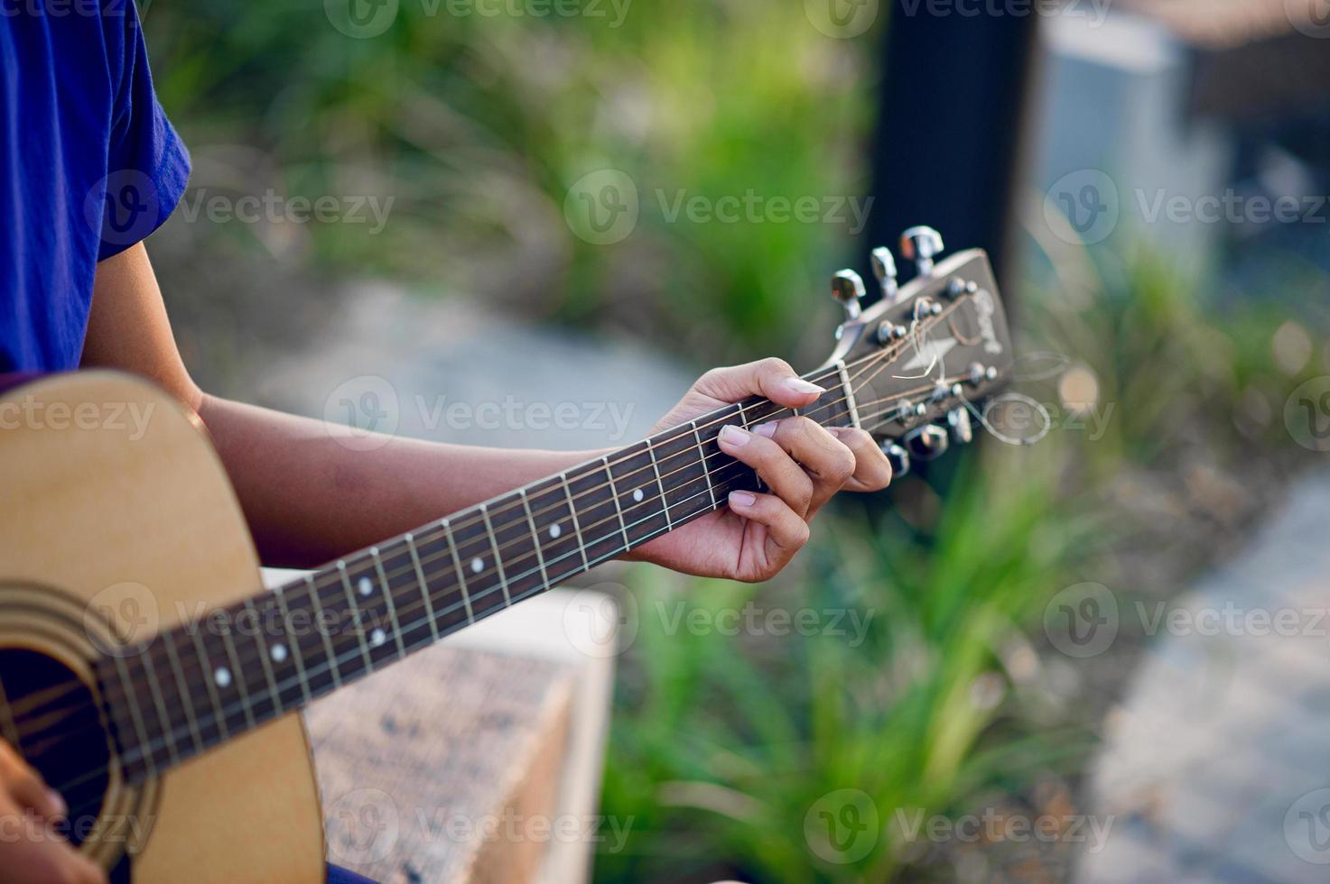 Hands and guitars of guitarists playing guitar concepts, musical instruments photo