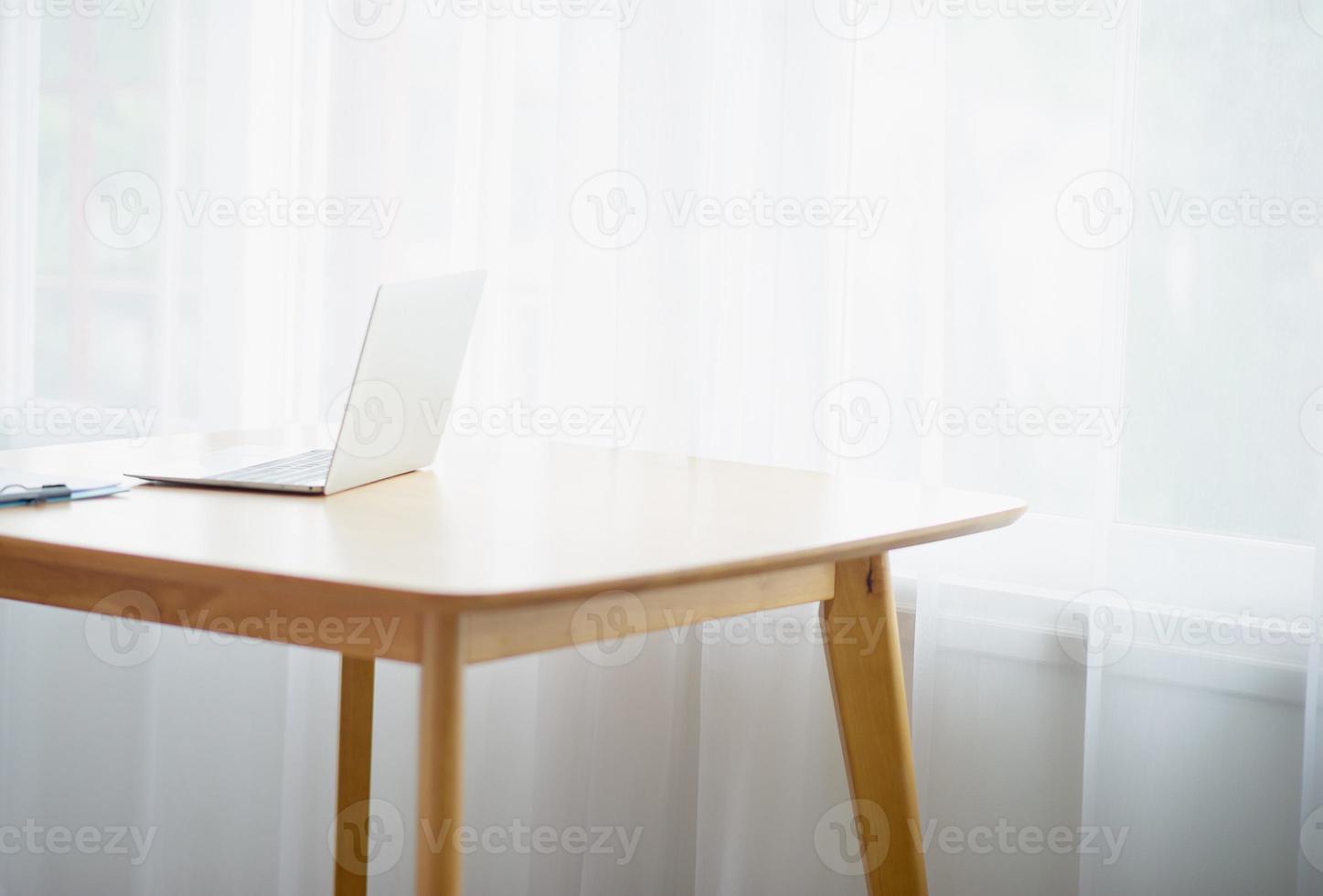 Desk and beautiful computer There is a light shining through the window in the morning - picture photo