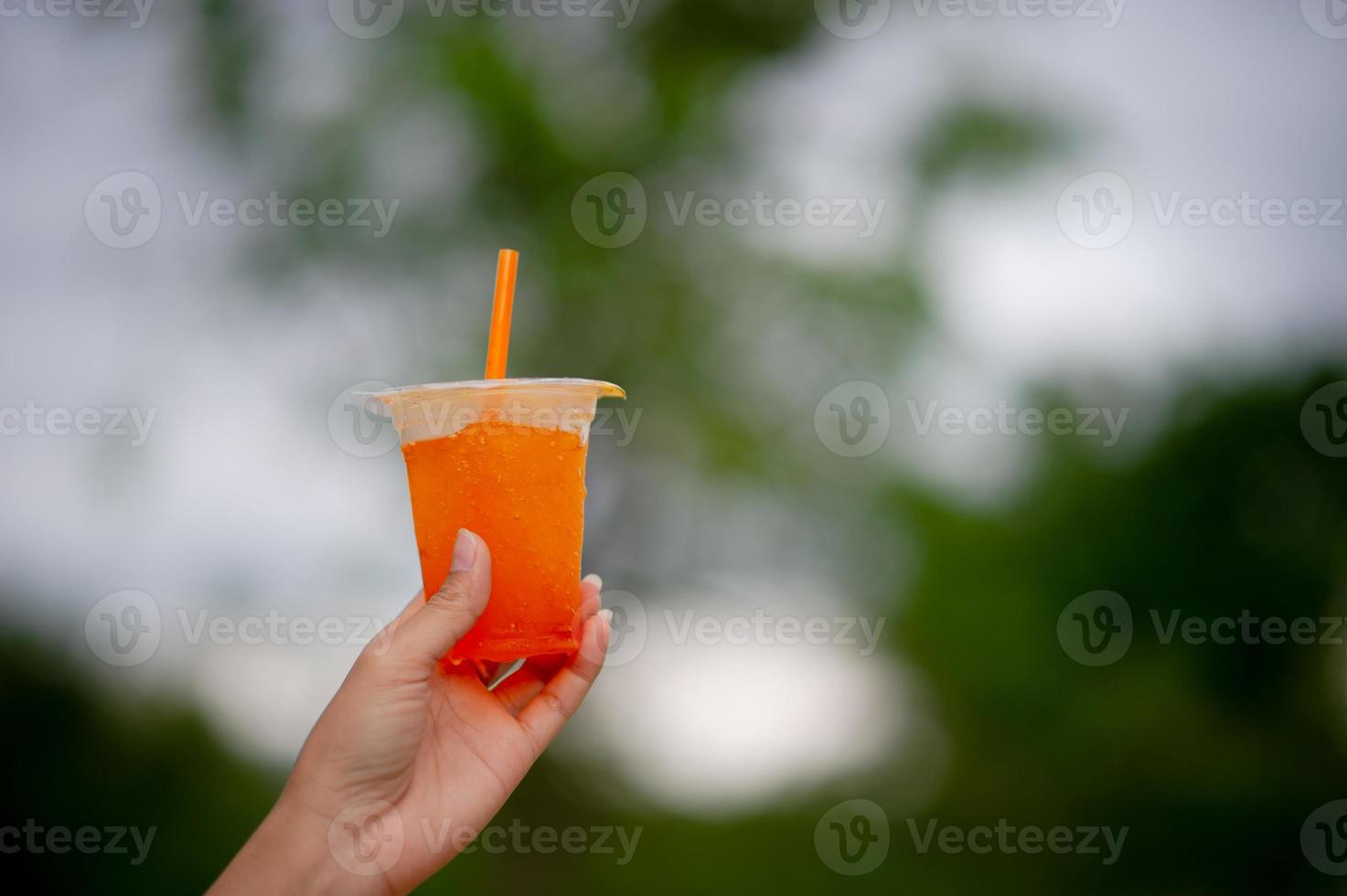 Hands and delicious orange juice For drinking healthy food drink ideas photo