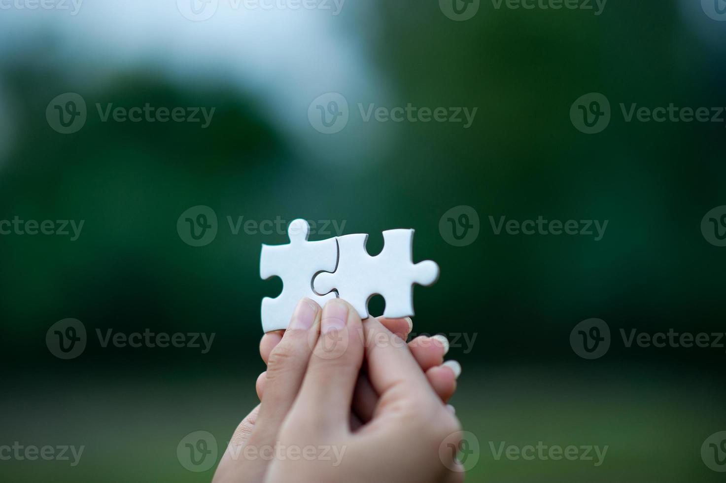 Hands and puzzles, important pieces of teamwork Teamwork concept photo