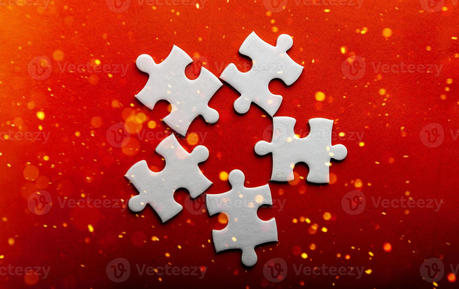 White puzzles placed on an orange background Represent the unity and power of successful people photo