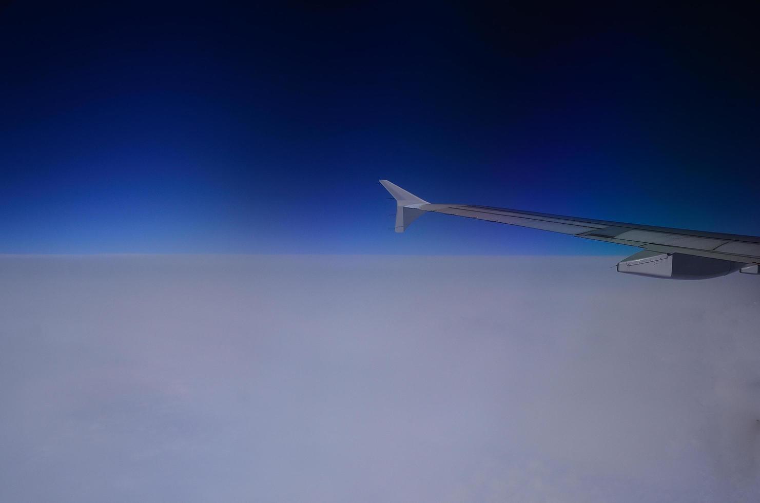 white blue horizon and airplane photo