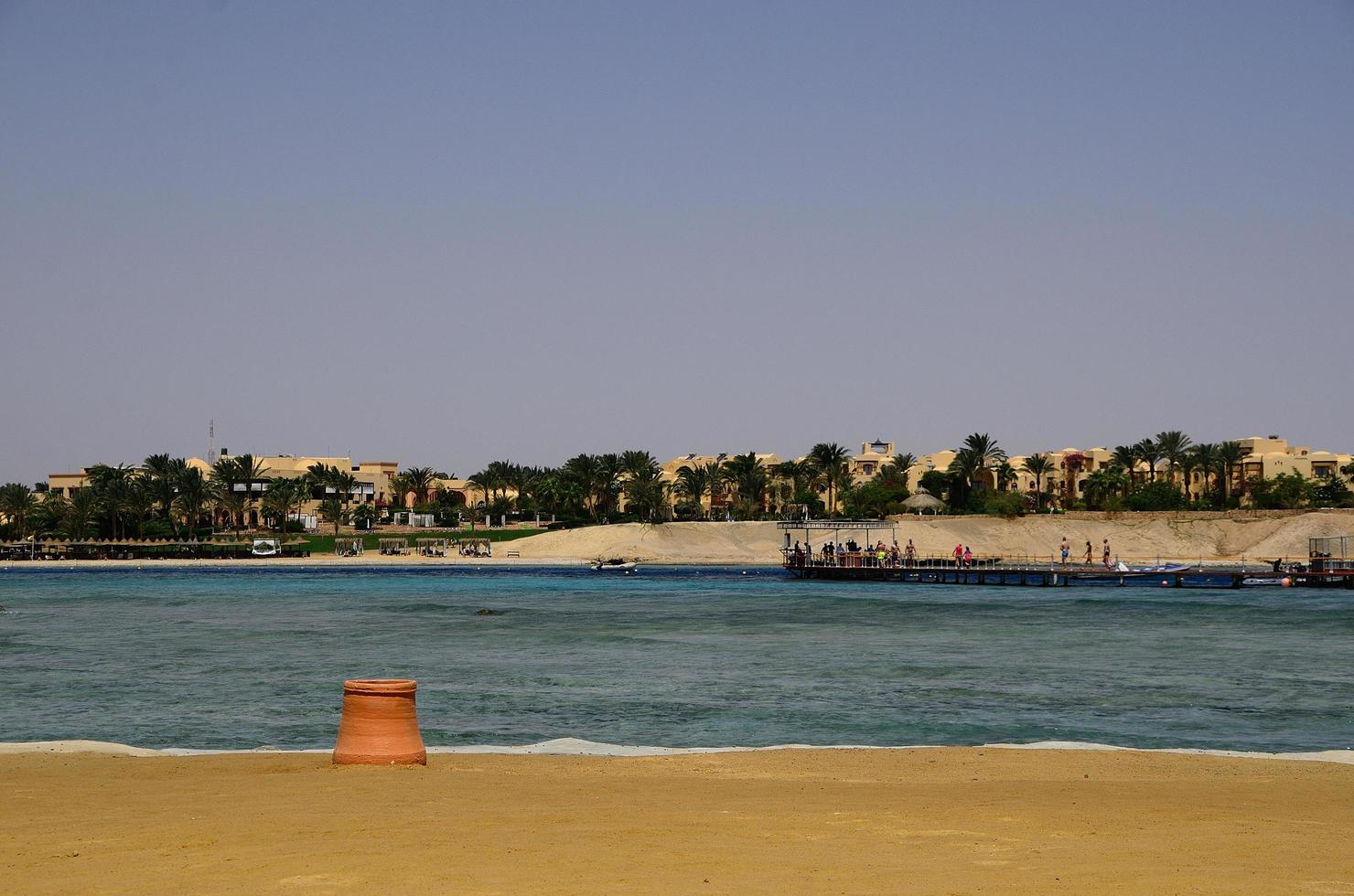 beach at sea with hotel complex photo