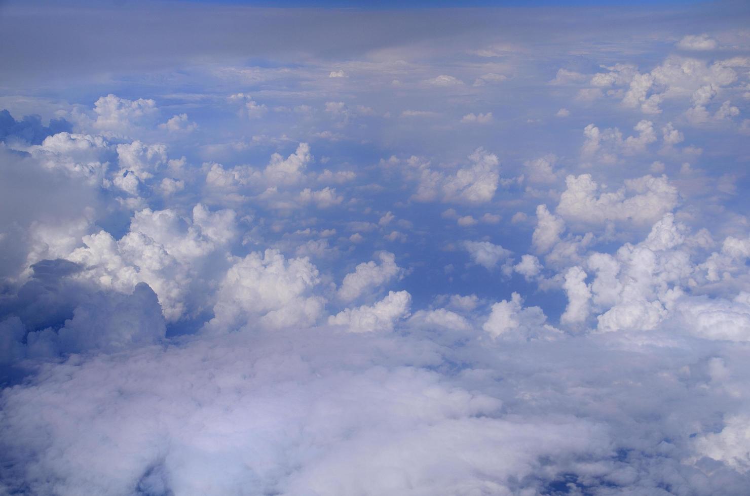 many white clouds in the sky photo