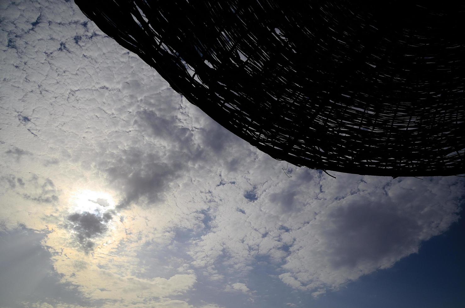 umbrella and beautiful clouds on the sky photo