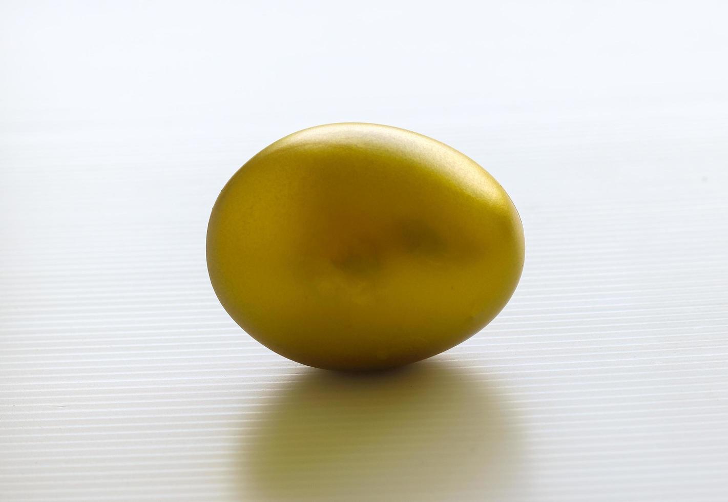 golden eggs on a white background for Easter photo