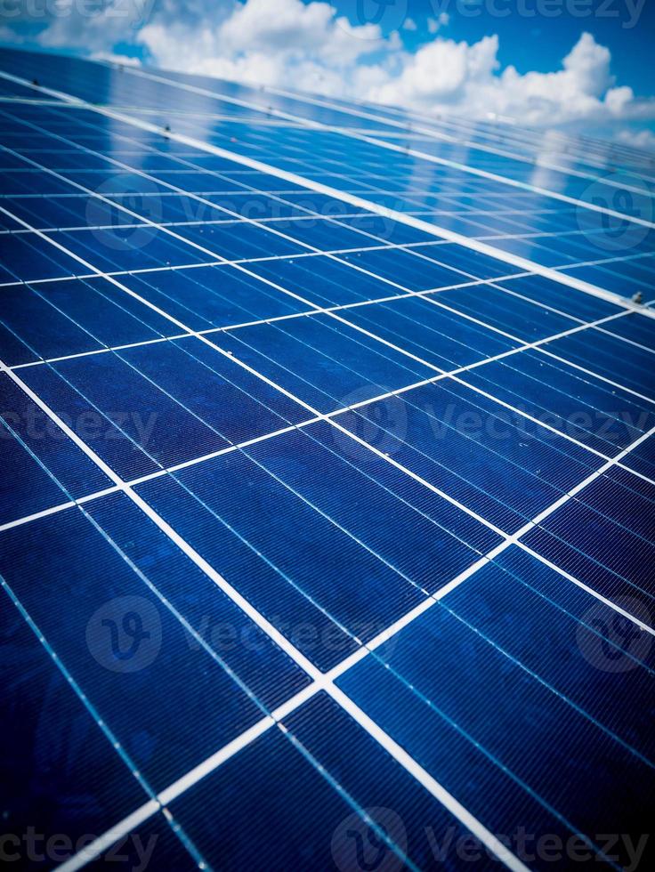 Solar panels with blue sky and clouds photo