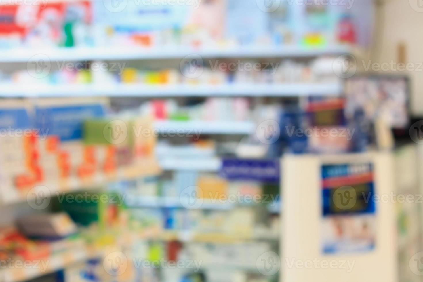 Medicines arranged in shelves at pharmacy photo