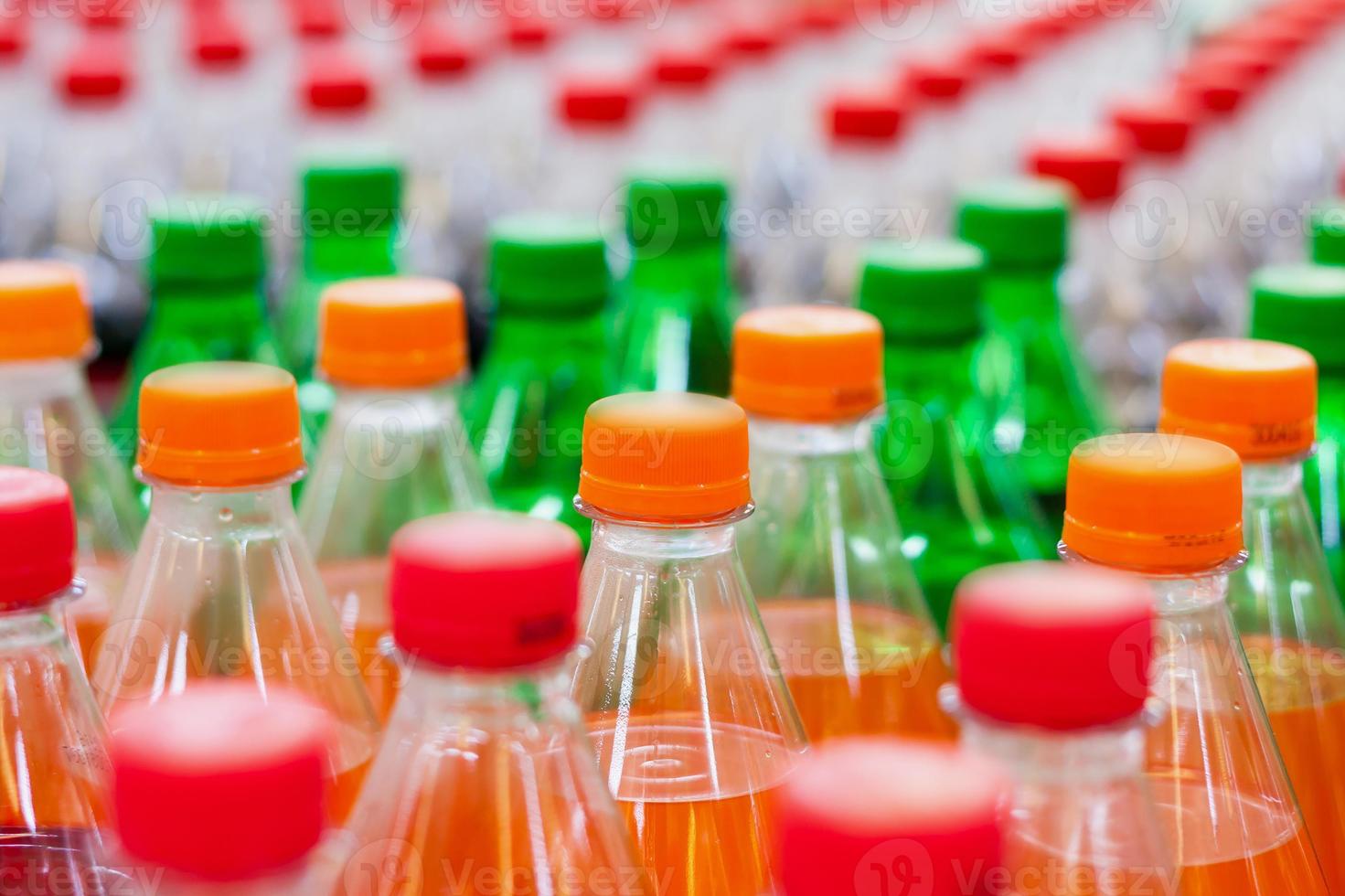 Bottles with soft drinks photo