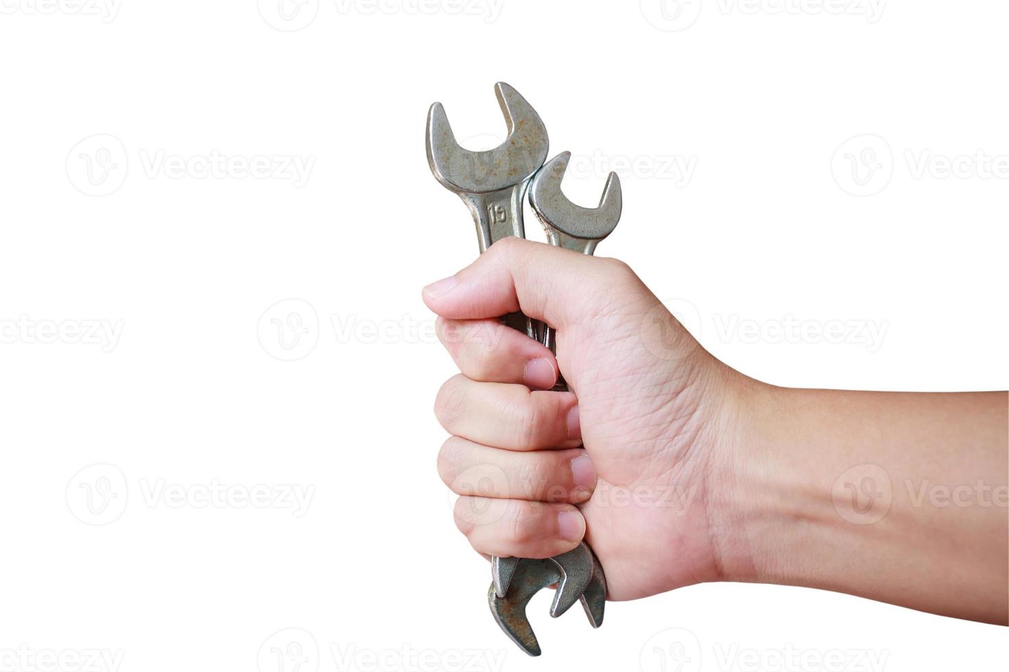 hand holding wrench isolated on white background photo