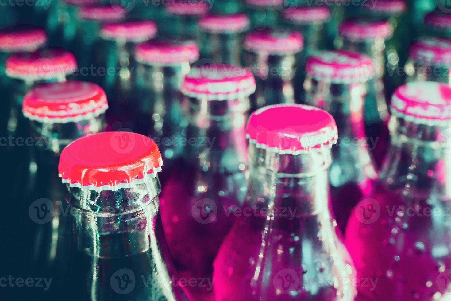 glass bottles with soft drinks background photo