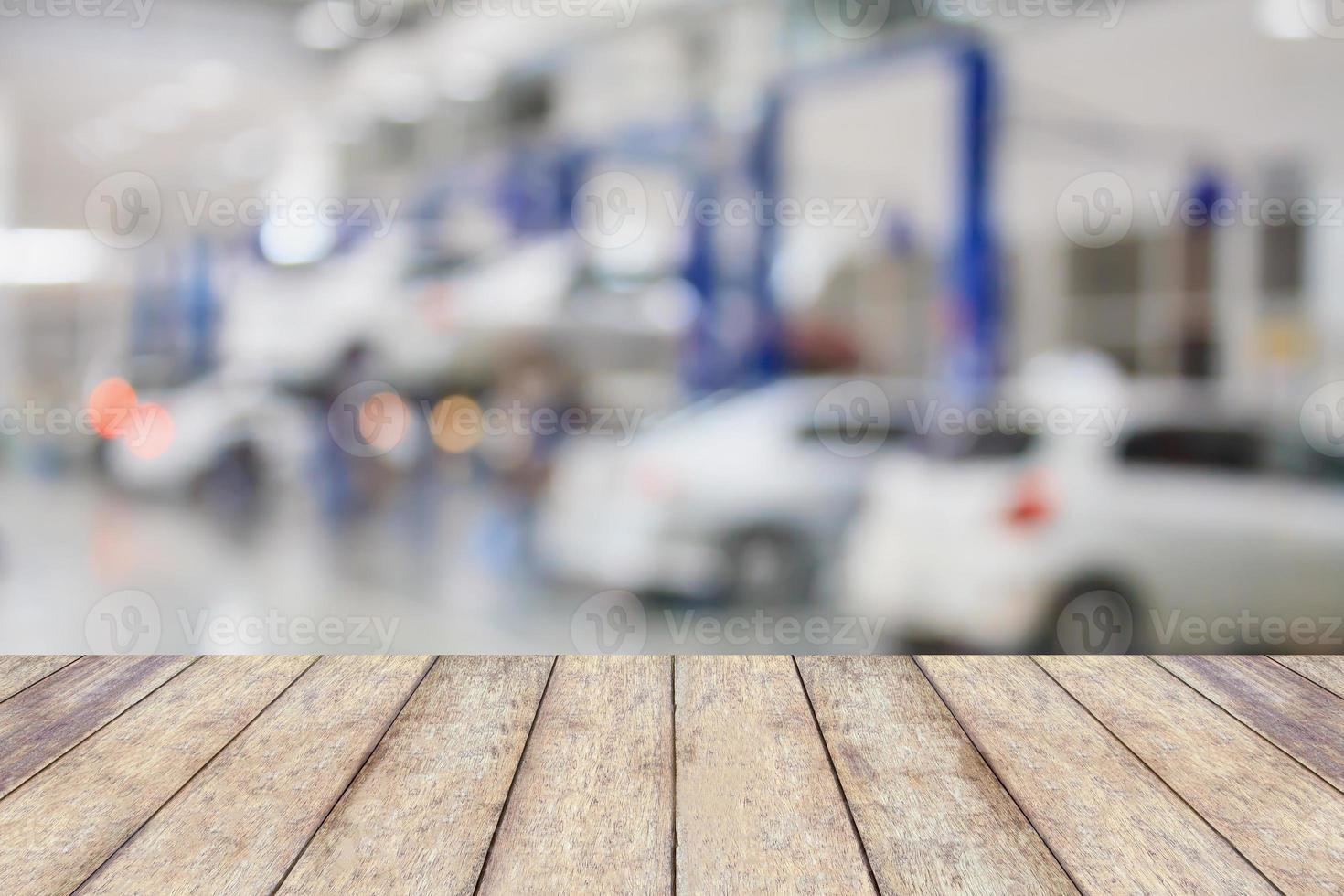 Wood table top with blur garage background photo