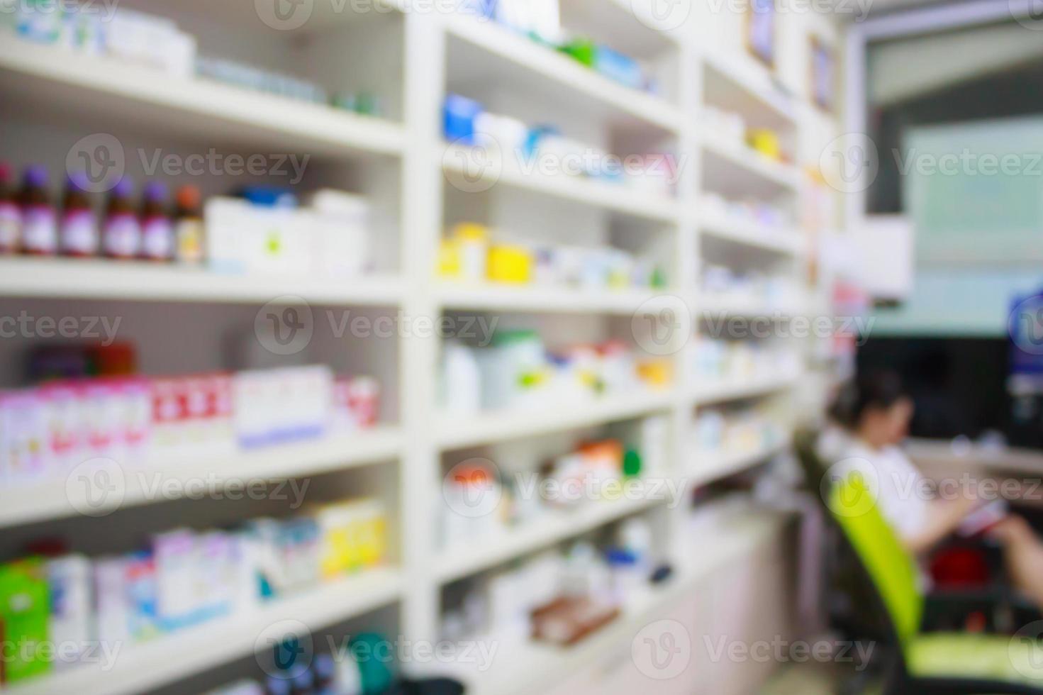 pharmacy store drugs shelves interior blurred background photo