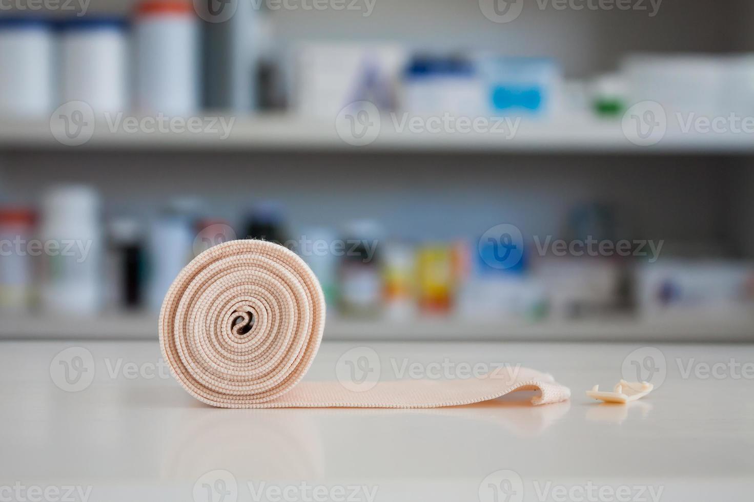 medical elastic bandage with blur shelves of drugstore photo