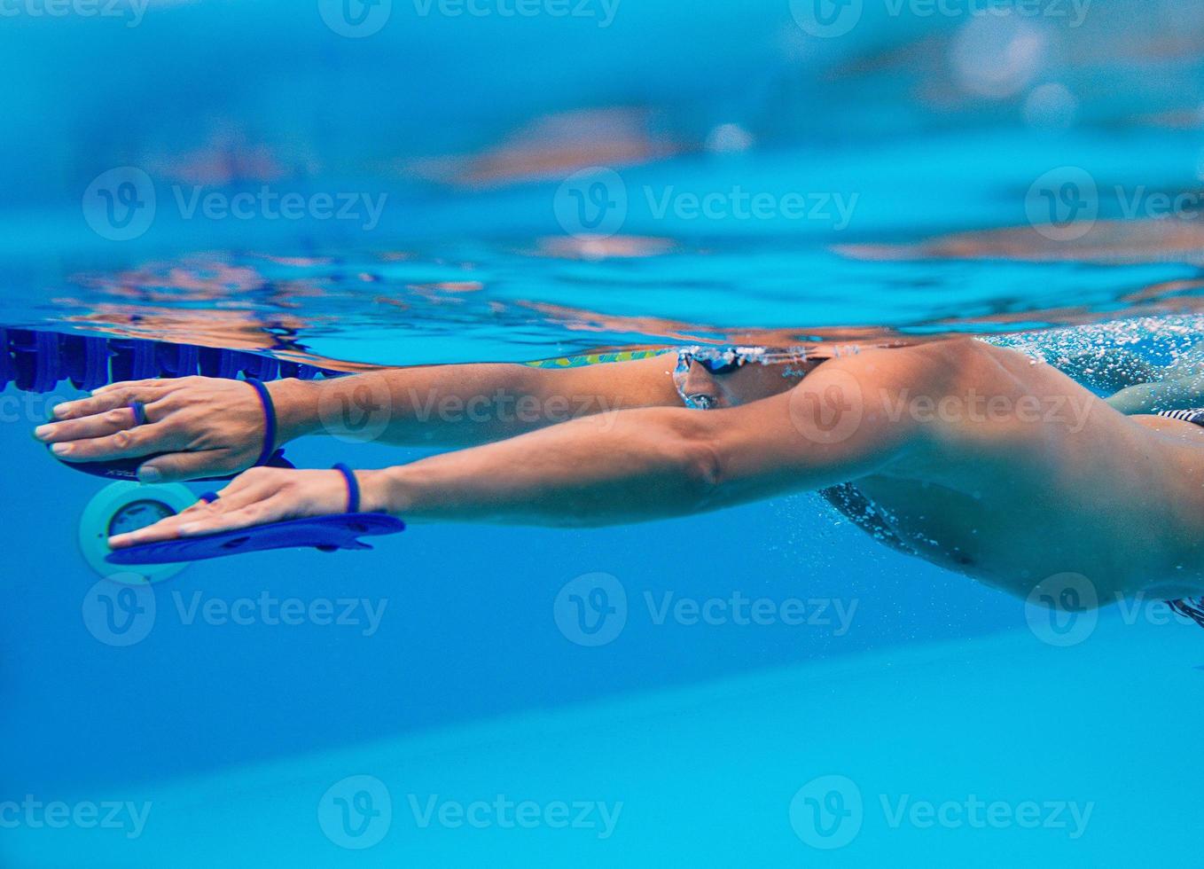 caucasian sportsman swimming in the swimming pool underwater photo