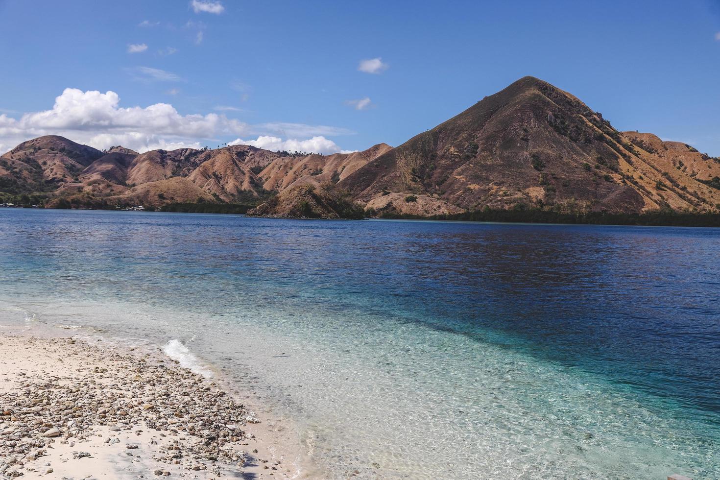 Exotic beach with mountain at Labuan Bajo photo