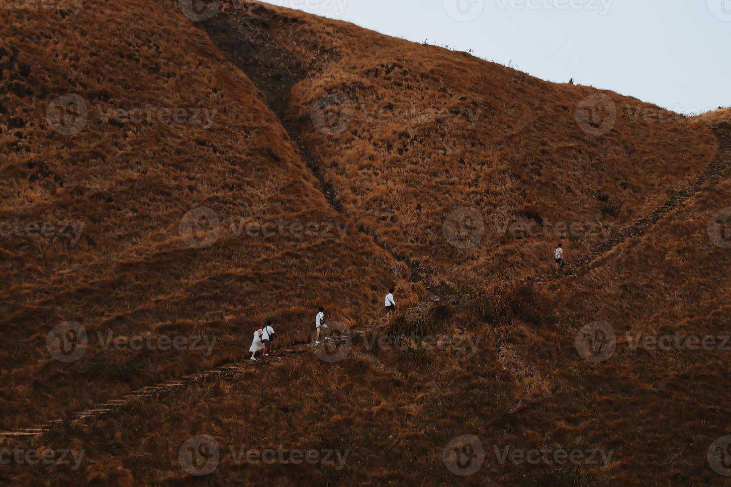 Tourists hiking in beautiful brown hill at Padar Island Labuan Bajo photo