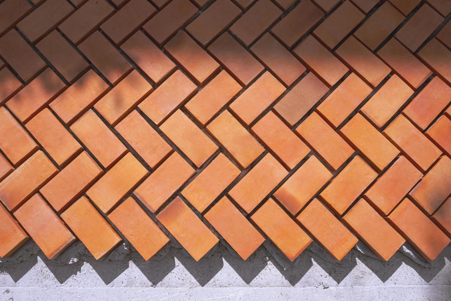 Sunlight and shadow on zig zag pattern of pedestrian pavement in under construction, top view with copy space photo