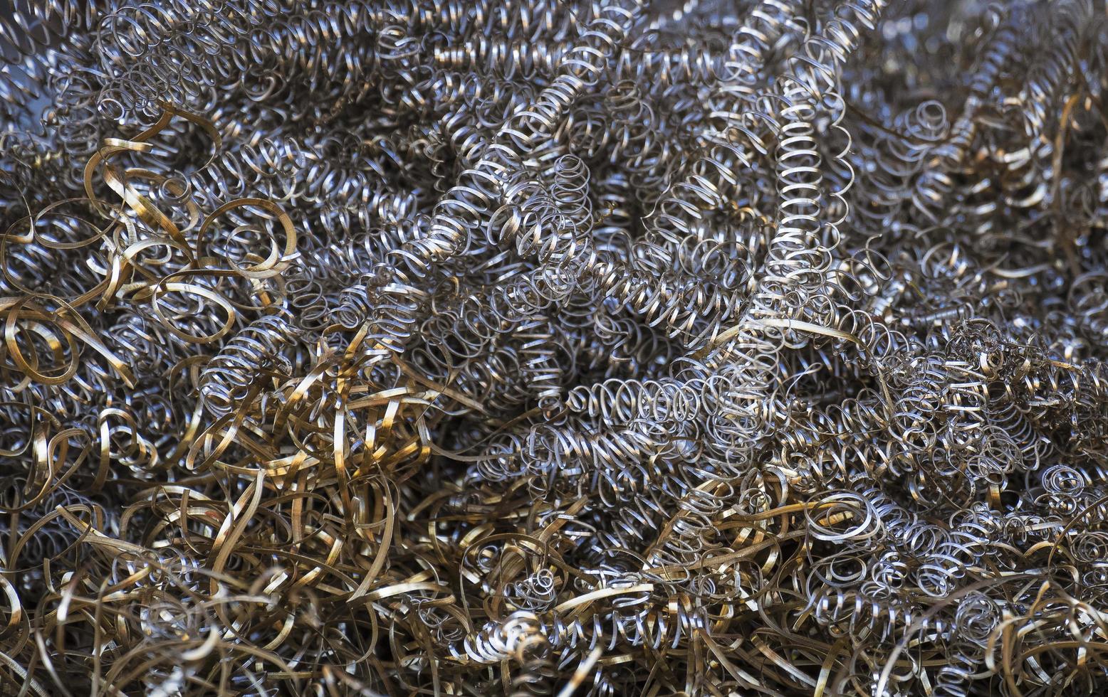 Background image of scrap brass and metal shavings for recycling photo