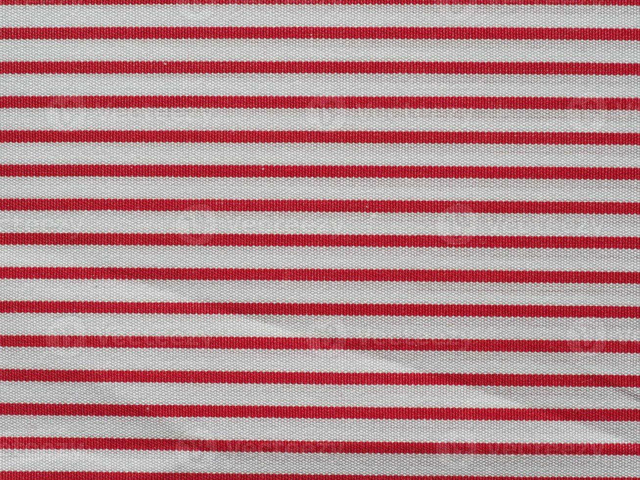 fondo de textura de tela de algodón rojo y blanco a rayas foto