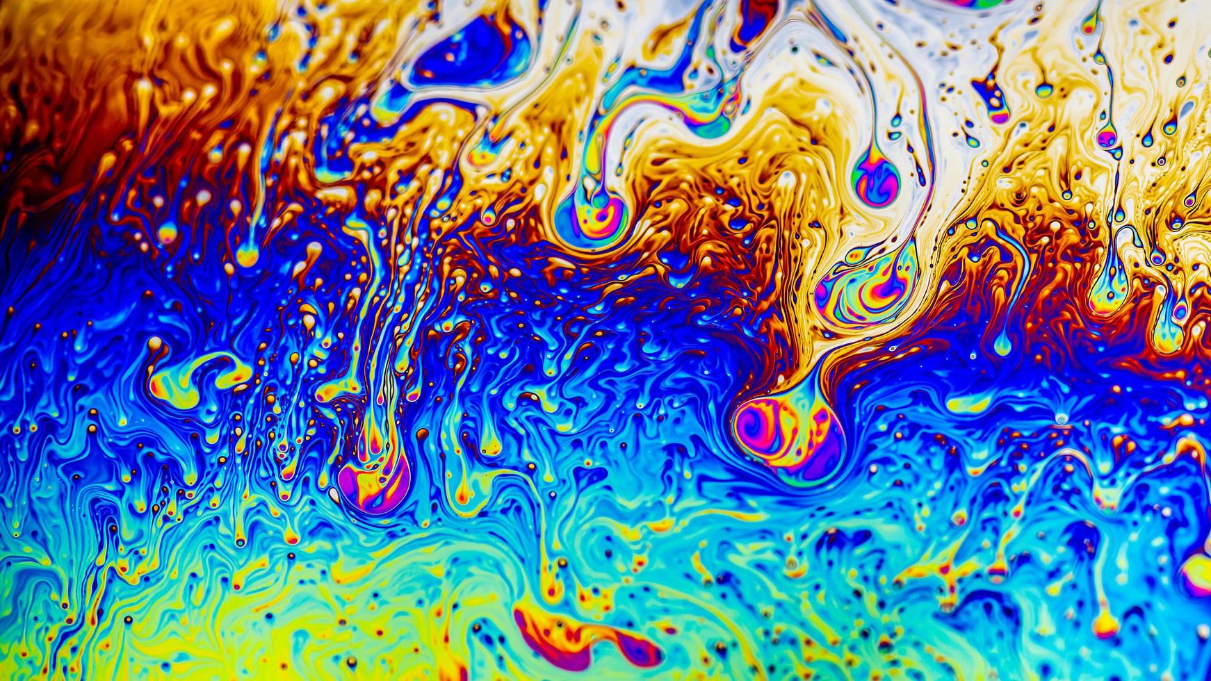 Extreme close-up of the colourful surface of a bubble photo