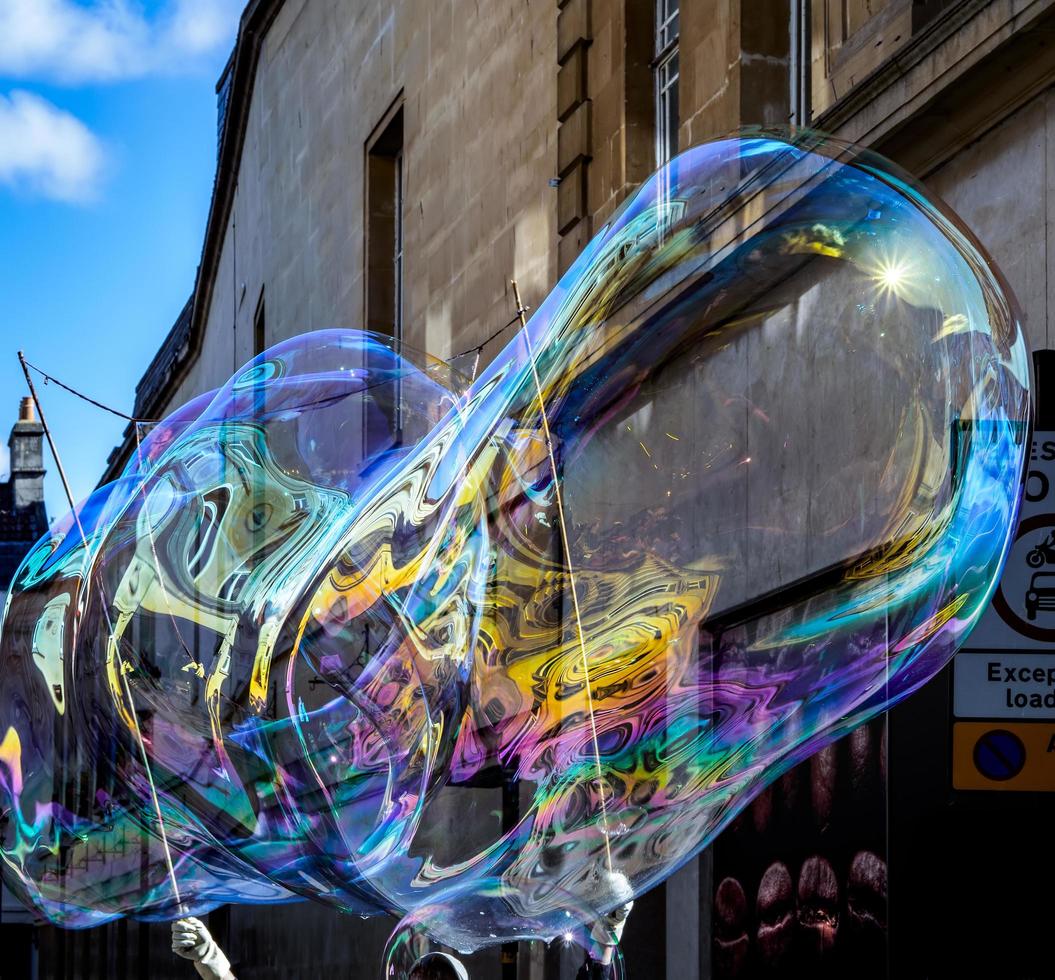 BATH, SOMERSET, UK, 2016. Bubblemaker working his magic in Bath on October 2, 2016. One unidentified man photo