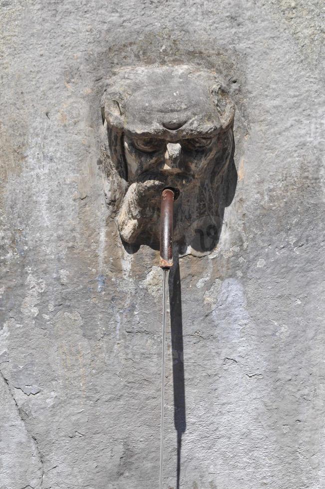 Ancient stone fountain photo