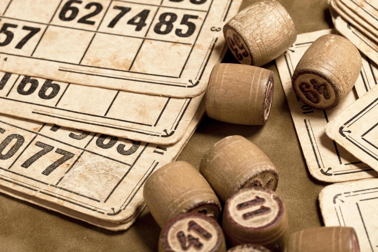 Table game Bingo. Wooden Lotto barrels with bag, playing cards for Lotto card game, leisure, play, strategy, gambling, lottery, photo