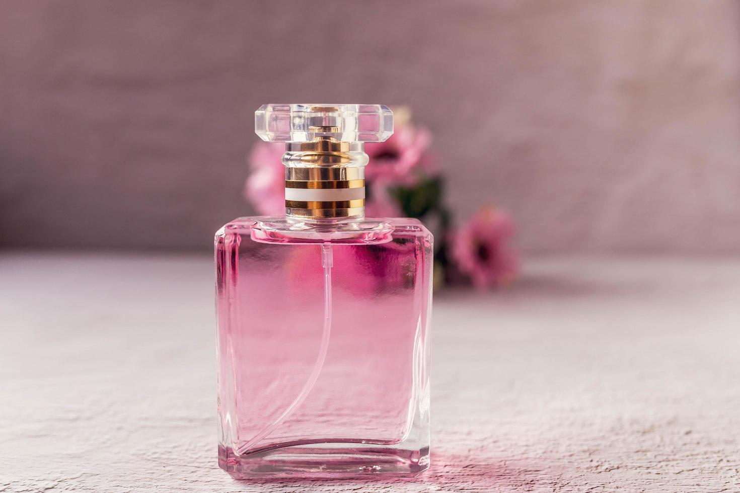 pink perfume bottle with pink flowers 6832520 Stock Photo at Vecteezy