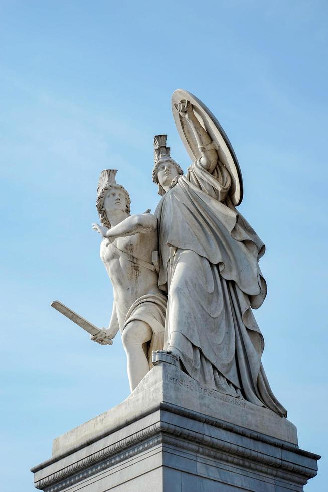 Berlin, Germany, 2014. Statue of Young man led to a new battle by Athena on the Castle bridge in Berlin photo