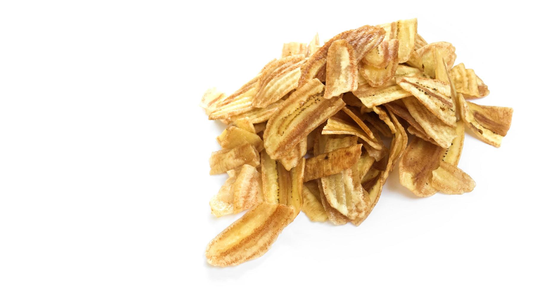 Asian caltivated banana or pisang awak banana cracker ro banana chips on white background, soft and selective focus. photo