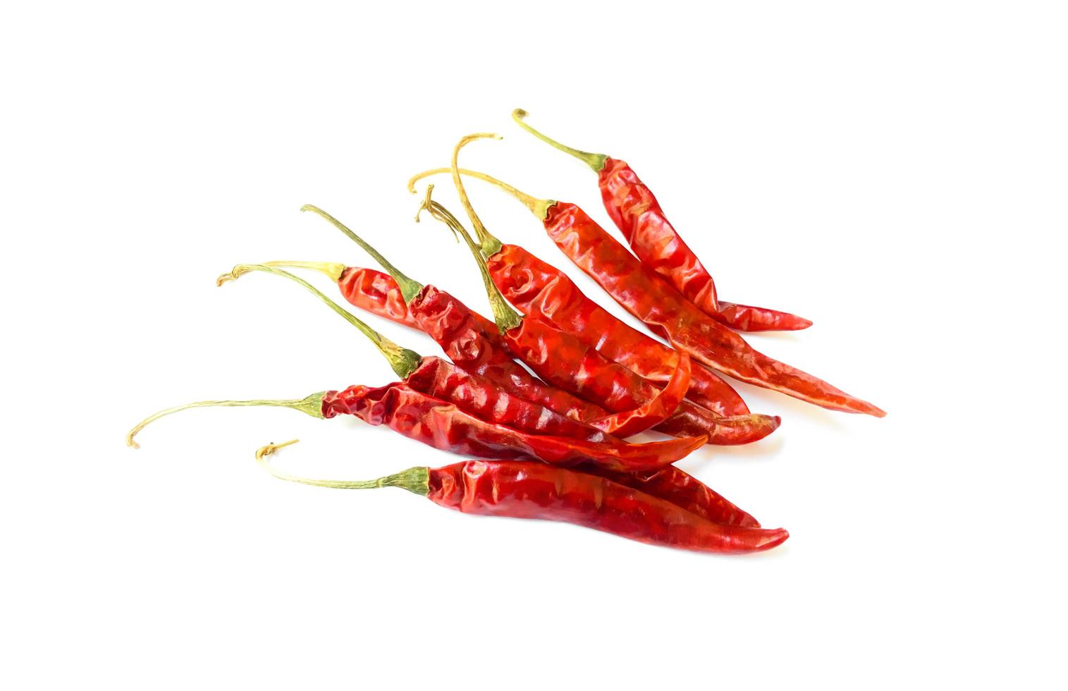 Dry red chillies on a white background photo