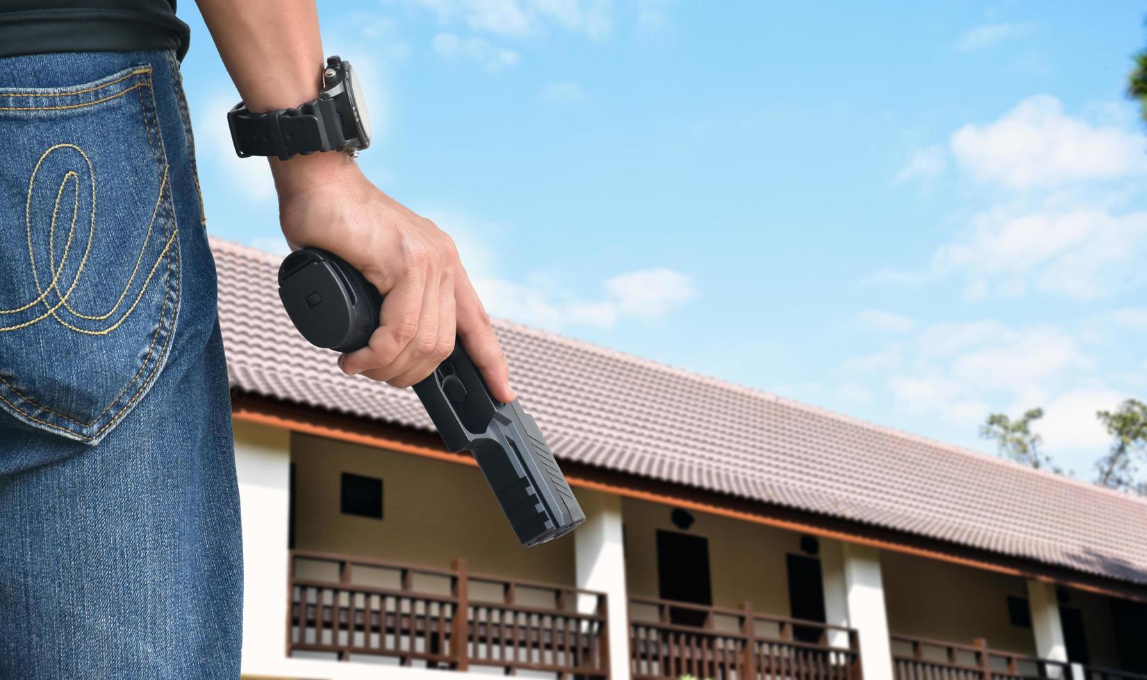 9mm automatic pistol holding in right hand of shooter, concept for security, robbery, gangster, bodyguard around the world. selective focus on pistol. photo