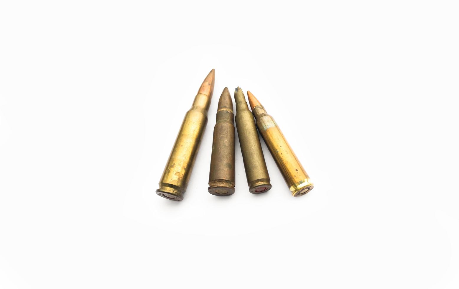 isolated old ak and m16 bullets on white background, soft and selective focus. photo