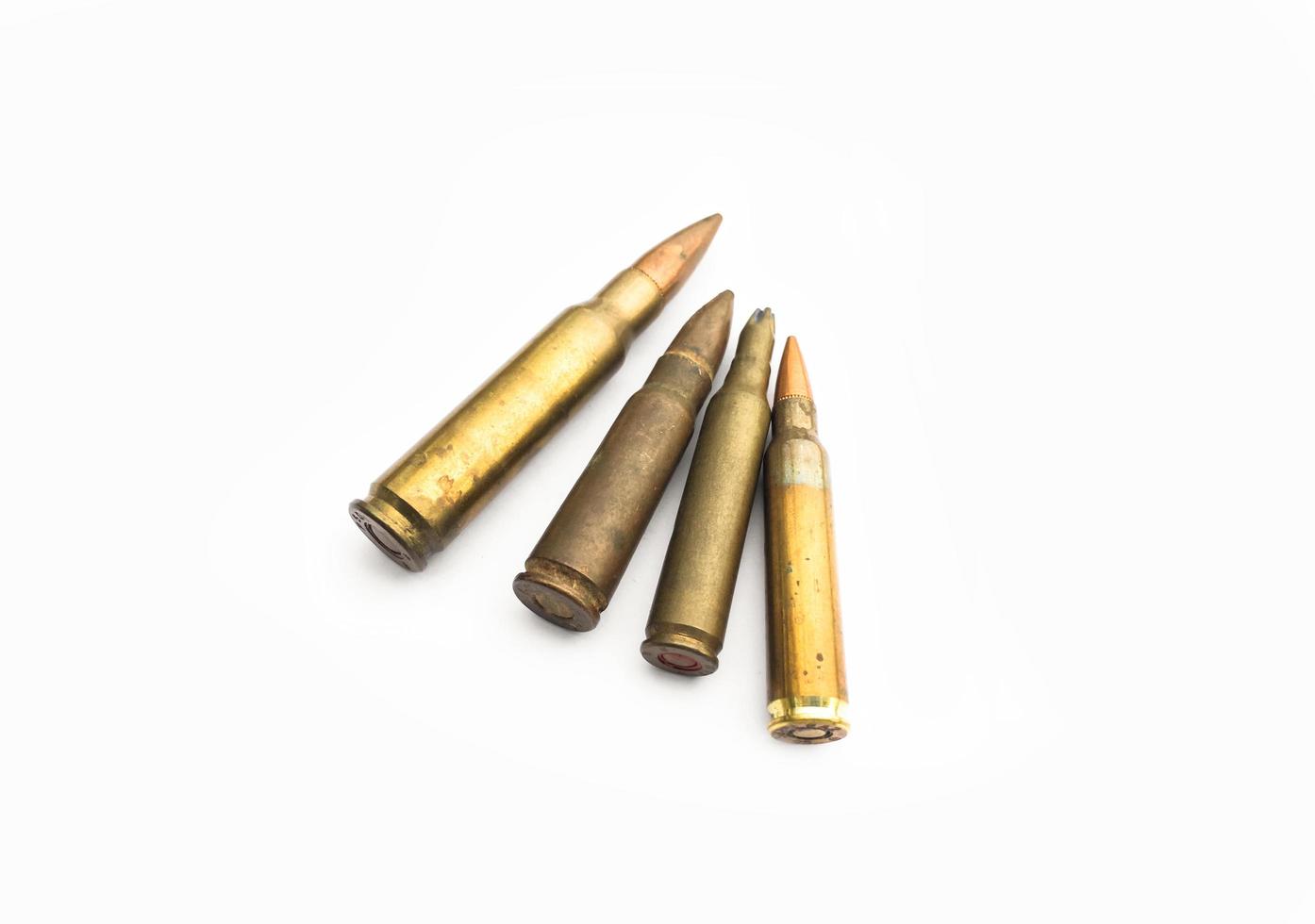 isolated old ak and m16 bullets on white background, soft and selective focus. photo