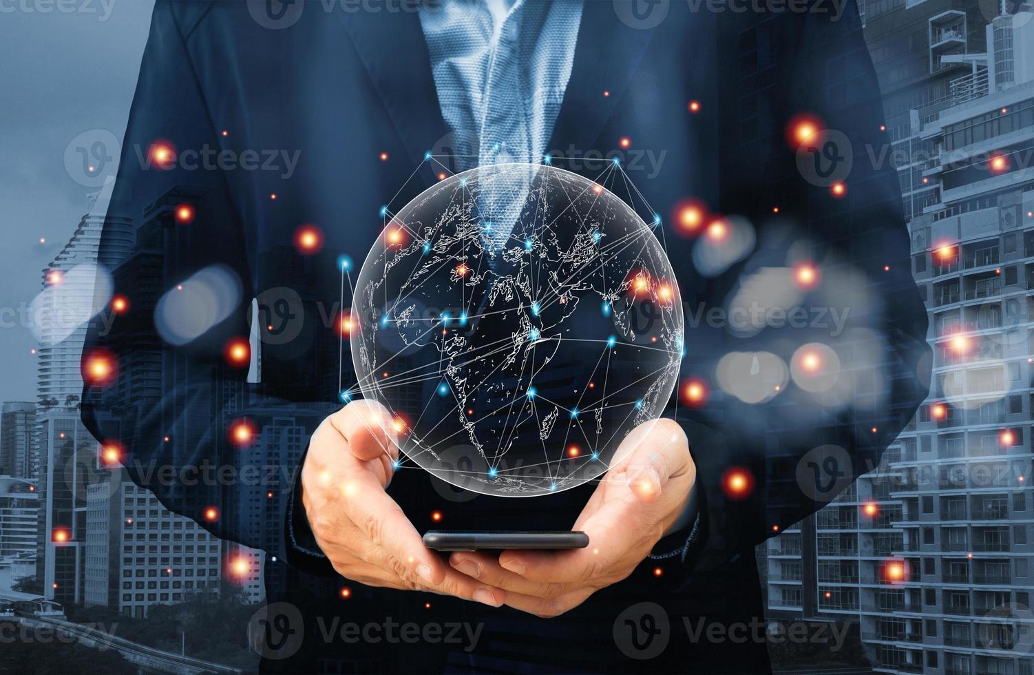 Hologram globes and networked connections in the hands of businessmen. communication network concept. photo