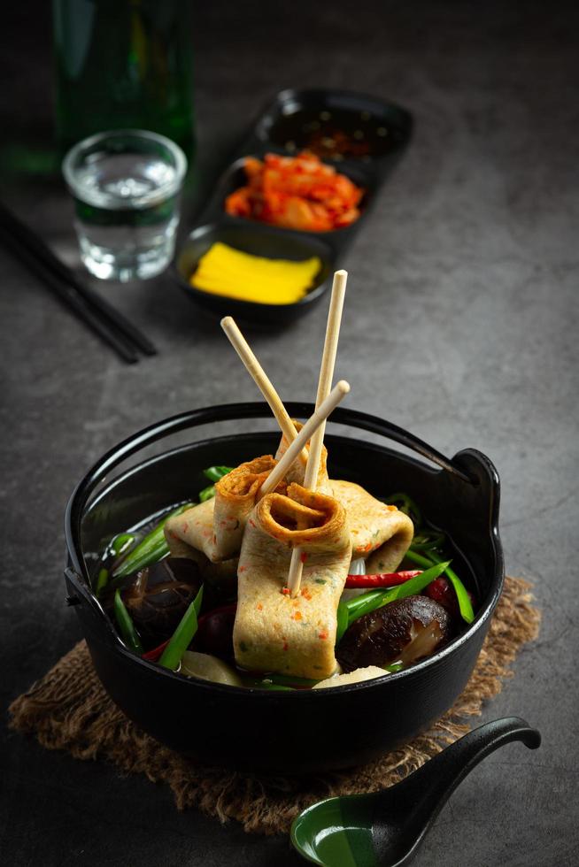 Korean fish cake and vegetable soup on table photo