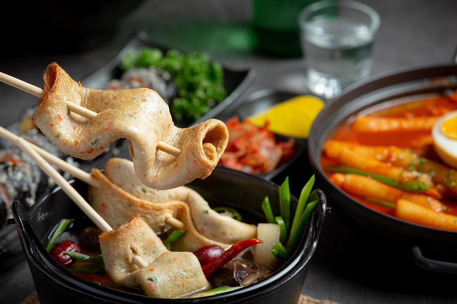 Korean fish cake and vegetable soup on table photo