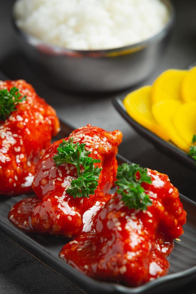 chicken fried in spicy sauce in korean style photo