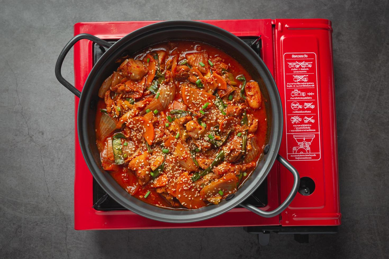 chicken fried in hot pot with spicy sauce in korean style photo