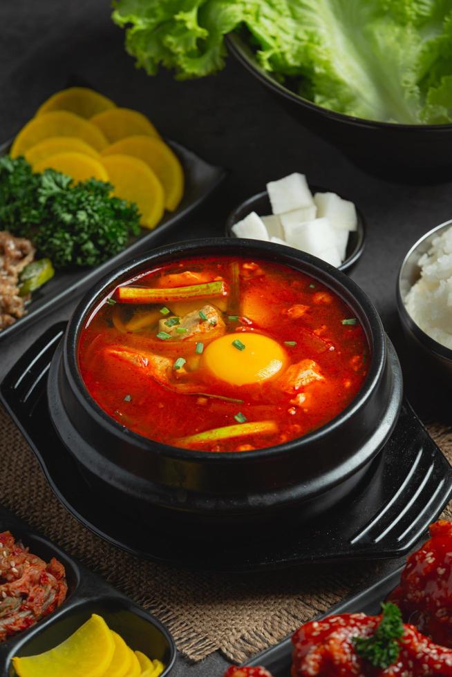 tofu and yolk boiled in spicy soup photo