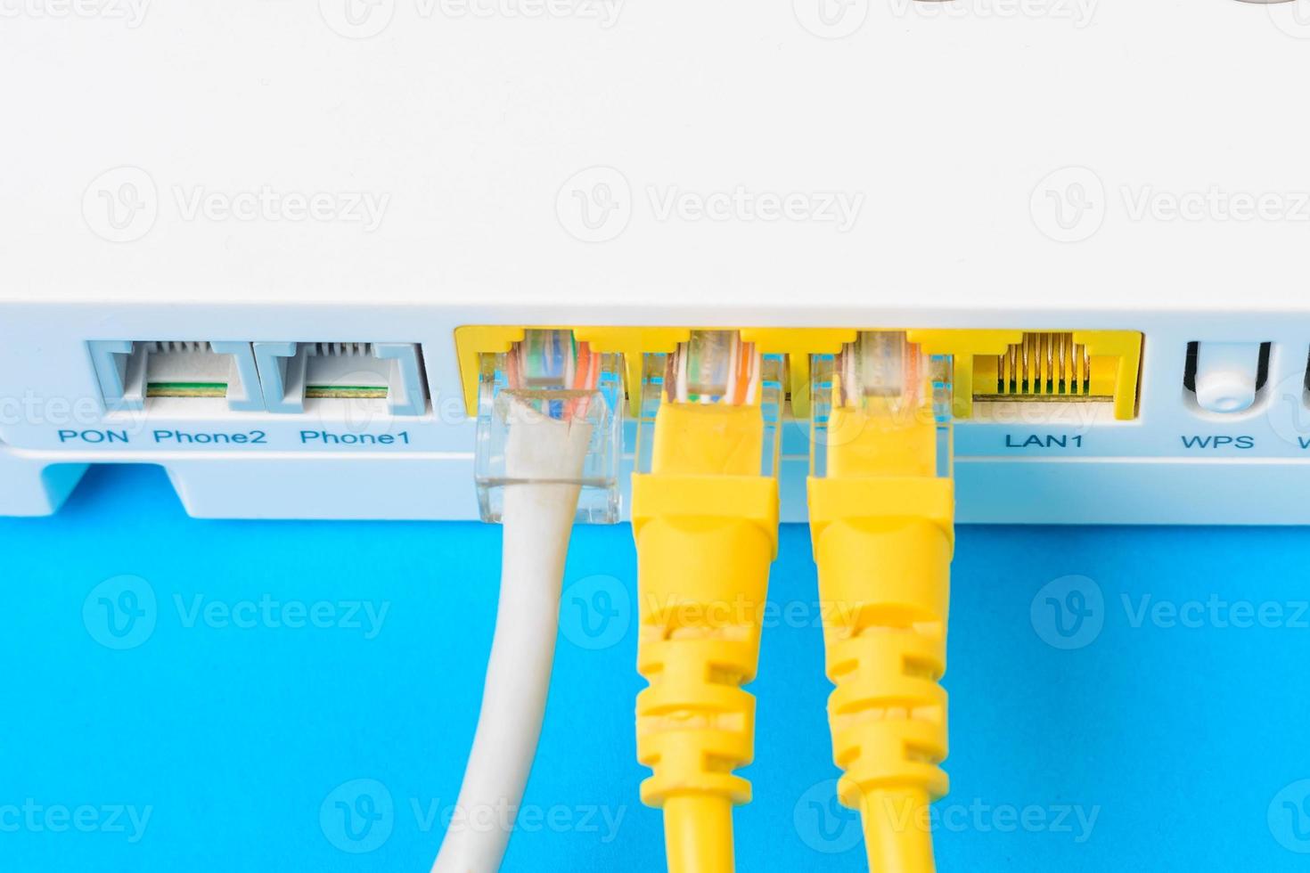 internet modem router hub with a cable connecting on blue background photo