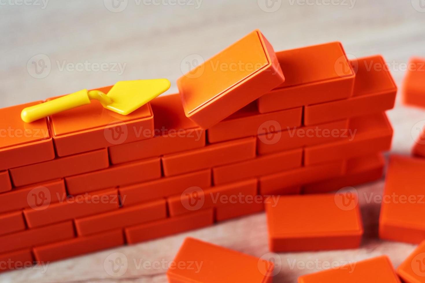 Construction concept. Brickwork and a building trowel close up photo