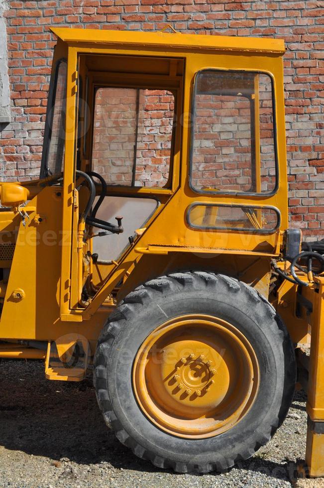 An old tractor vehicle machinery used in agriculture or construc photo